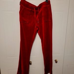 Red flared velvet track pants